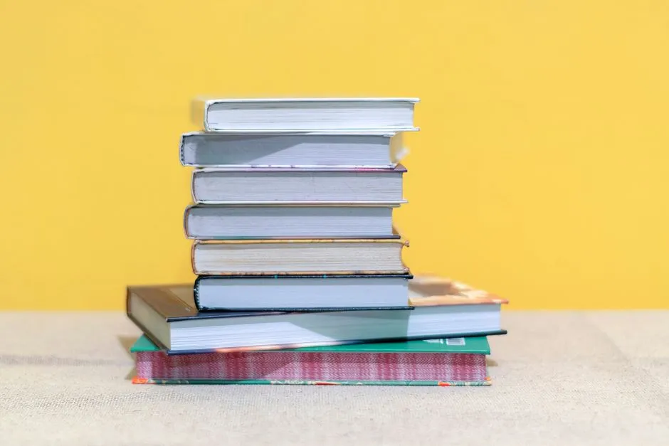 A stack of school textbooks representing the range of subjects covered